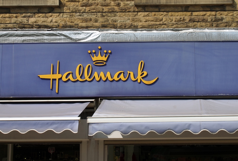 sign and logo above a hallmark card and gift store