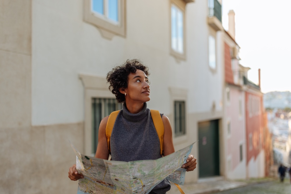 Young female tourist holding a map
